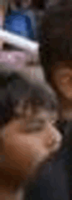 a blurry picture of a person 's face with a blurred background .