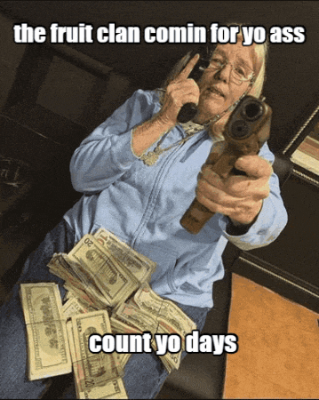 an older woman is holding a gun in front of a pile of money with the caption " the fruit clan comin for yo ass "