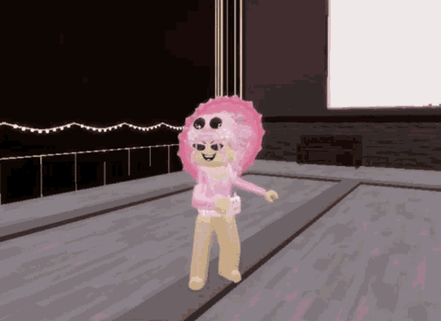 a girl with pink hair and sunglasses is standing on a stage