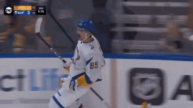 a hockey player with the number 89 on his jersey is on the ice