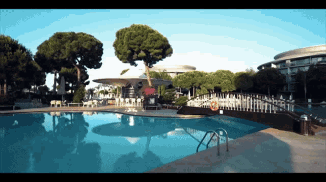 a large swimming pool with a life preserver on the edge