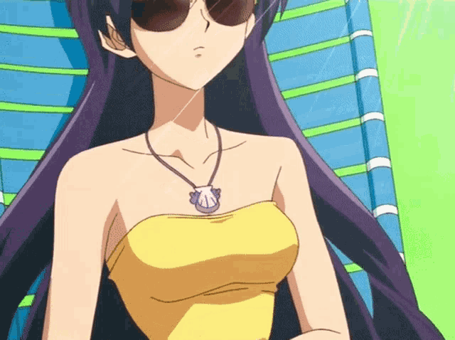 a girl wearing sunglasses and a yellow top has a necklace with a shell on it