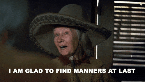 a woman wearing a sombrero and a bow tie says i am glad to find manners at last