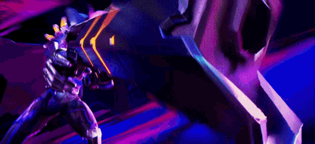 a person in a futuristic suit is holding a large gun