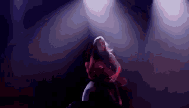 a woman in a red dress is dancing on a stage with purple lights behind her