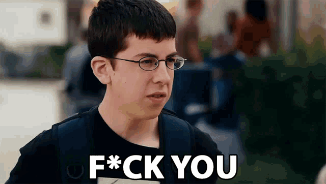 a boy wearing glasses says f * ck you