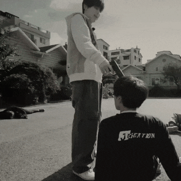 a man wearing a black shirt that says creation on the back