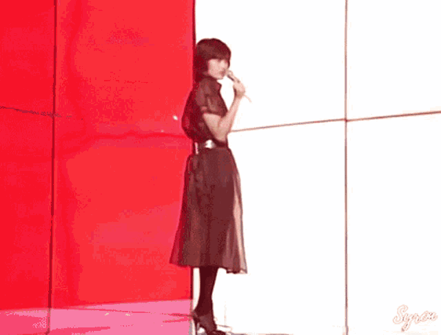 a close up of a woman singing into a microphone