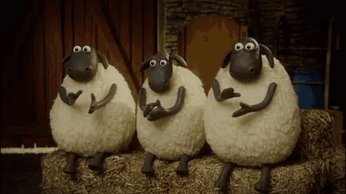 three cartoon sheep are sitting on hay bales