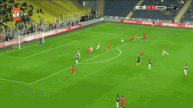 a soccer game is being shown on a tv screen