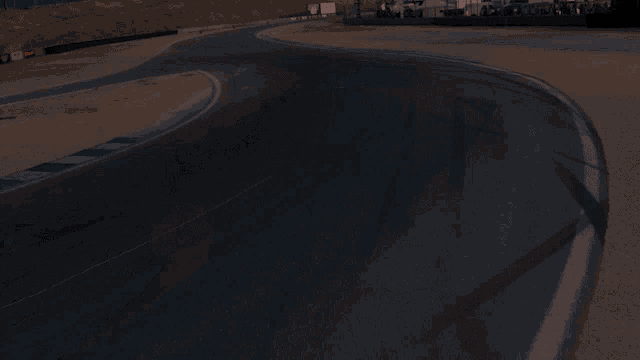 a row of cars are driving down a race track with a sign that says ' a ' on it