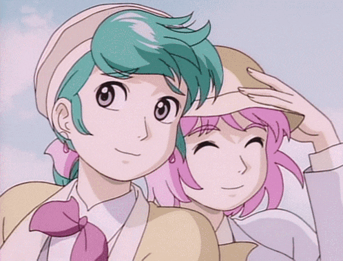 a girl with pink hair and a boy with green hair are standing next to each other