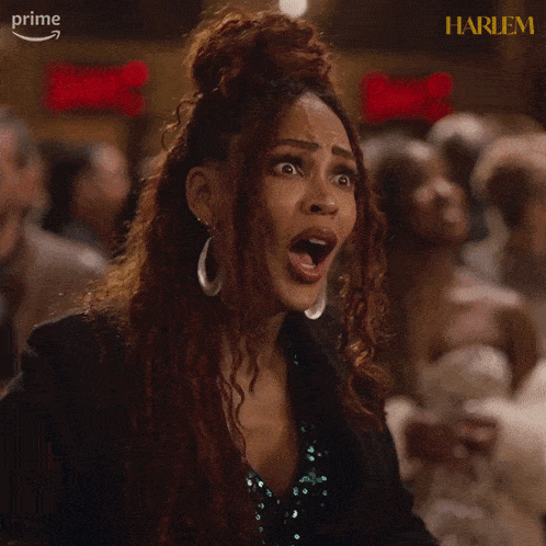 a woman with a surprised look on her face and the word harlem on the bottom right