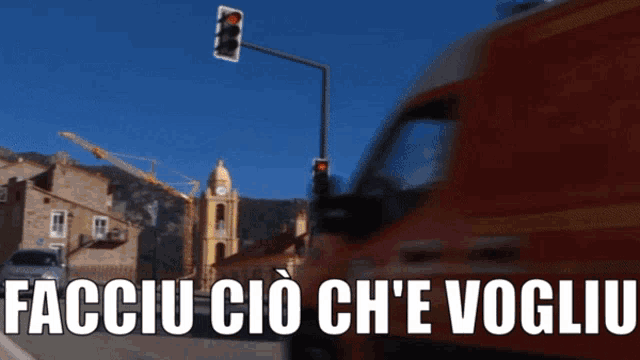 a red van is driving down a street with the words facciu cio ch'e voglio written on the bottom
