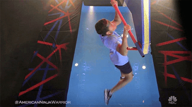 a man is doing a ninja warrior exercise on the nbc channel