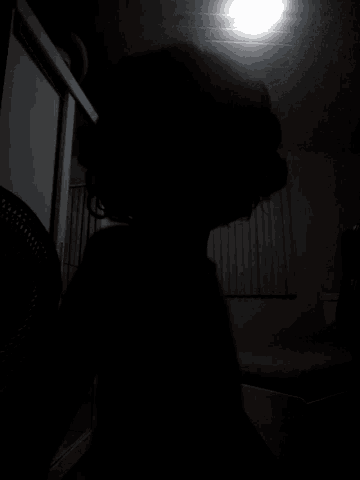 a light is shining in the dark with a black background