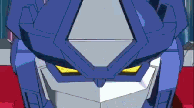 a close up of a robot 's face with blue eyes