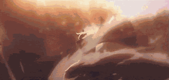 a person is flying through the air in a cloudy sky with a bird flying in the background .