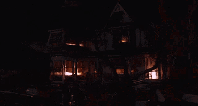 a house is on fire with smoke coming out of it