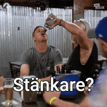 a man is drinking from a bottle and the word stankare is on the screen