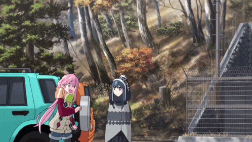 a girl with pink hair is standing next to another girl with blue hair