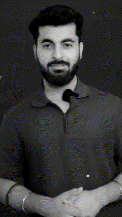a man with a beard is smiling and giving a thumbs up