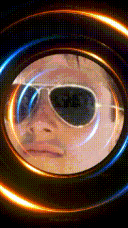 a man wearing sunglasses is reflected in a circle of lights