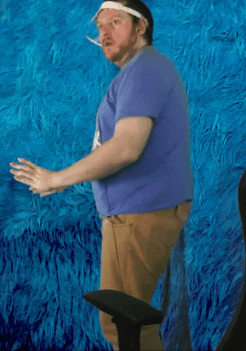 a man wearing a blue shirt that says " rock " on it