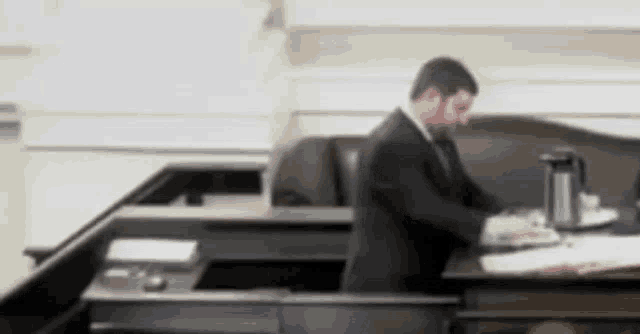 a blurry picture of a man in a suit and tie