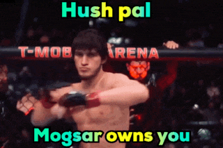a man in a boxing ring with the words hush pal mogsar owns you above him