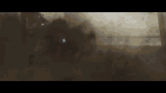a dark room with a lot of smoke coming out of it .