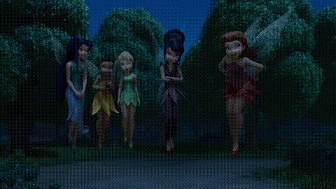 a group of fairies standing next to each other on a path