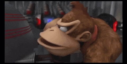 donkey kong is playing a video game and looking at the camera