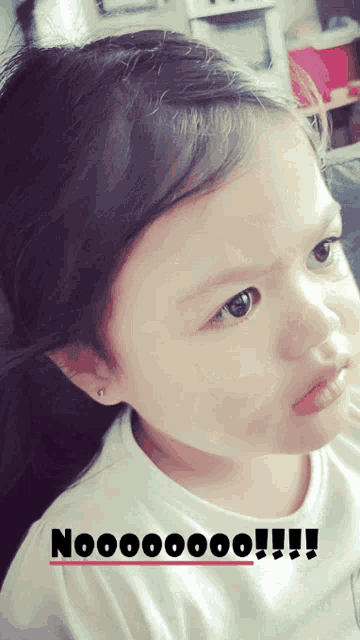 a picture of a little girl with a caption that says no