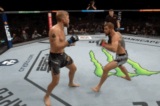two men are fighting in a boxing ring with a monster on the ground
