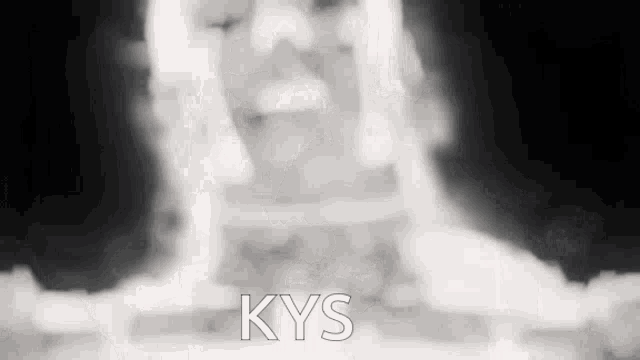 a black and white photo of a person 's face with the word kys written on it .