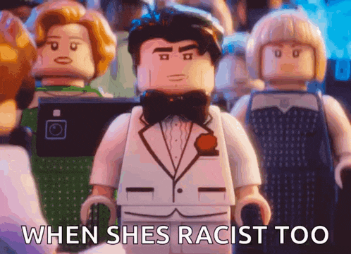 a lego man in a tuxedo and bow tie is standing in front of a crowd and says when shes racist too