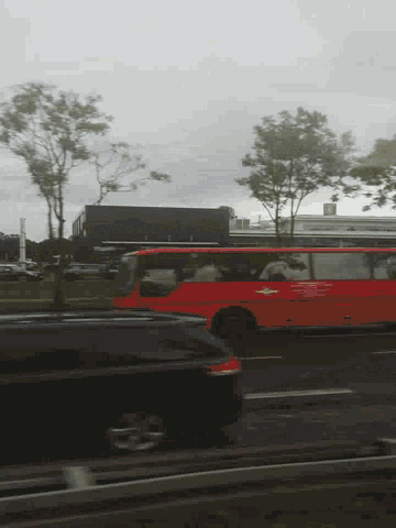 a red chevrolet van is parked on the side of a road