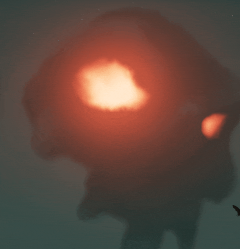 a blurred image of a person 's head with a red light coming out of it