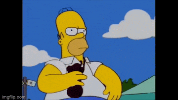 homer simpson from the simpsons is holding a black object