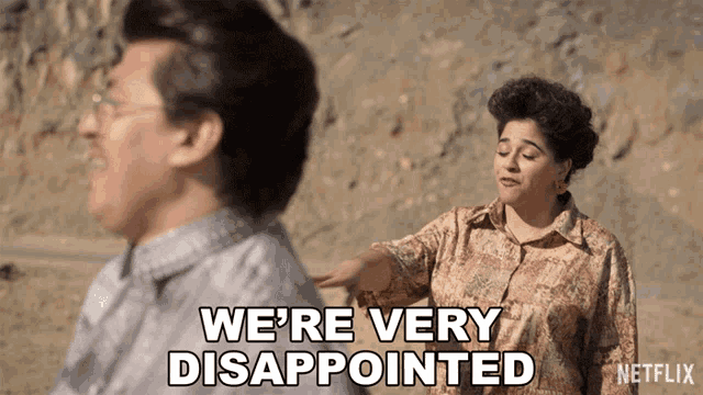 a man and a woman are standing next to each other and the woman is saying we 're very disappointed