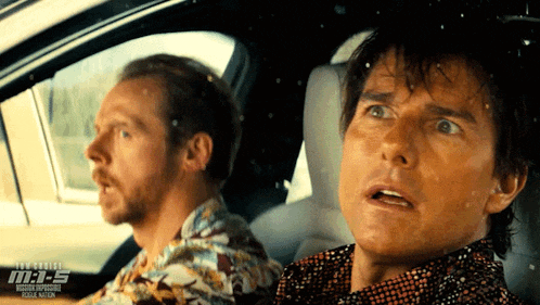 two men are sitting in a car with the words tom cruise m.i.s. on the bottom