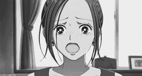 a black and white photo of a girl with her mouth open and a surprised look on her face .