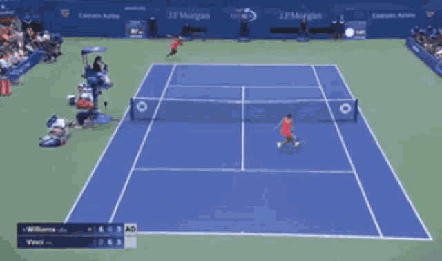 a woman is holding a tennis racquet over her head