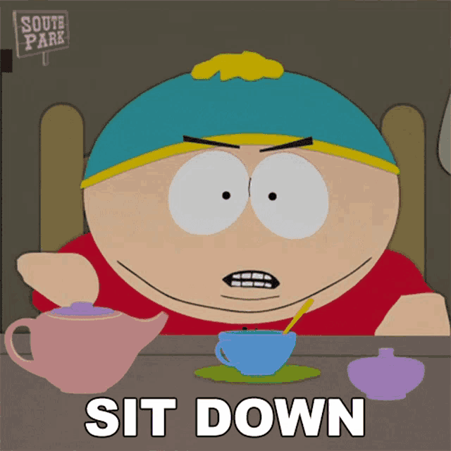 a cartoon character from south park sits at a table with a sign that says south park on it