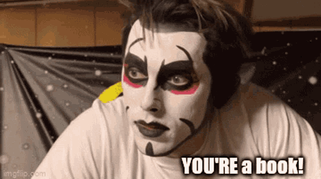 a man with face paint and the words " you 're a book " on the bottom