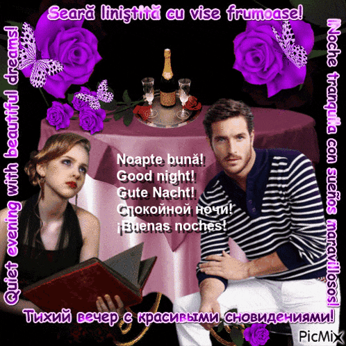 a man and woman sit at a table with purple roses and a bottle of wine