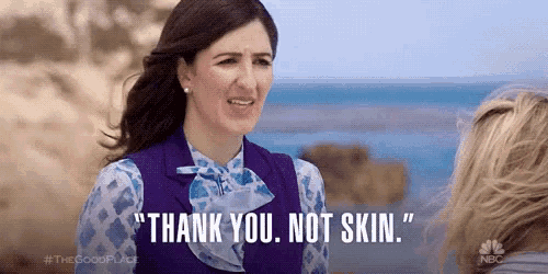 a woman is standing next to another woman and says `` thank you , not skin . ''