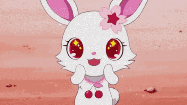 a white rabbit with pink ears and a star on its head