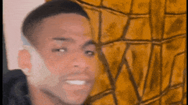 a blurry picture of a man 's face with a spider web in the background